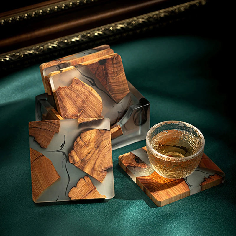 Wooden Tea Coaster Resin - Insulation set displayed with glass cup on green surface. Durable square design blends Thuja wood and resin.