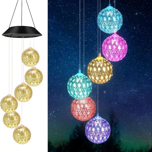 Morocco Ball Solar Wind Chime Light with six LED balls hanging from a black solar panel, glowing in multicolor for garden decor.