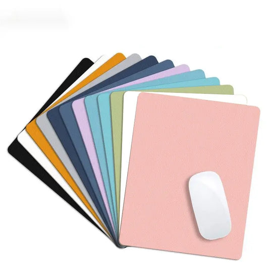 Small PU Leather Gaming Mouse Pad in assorted colors with non-slip base, ideal for desktops and compact gaming setups.