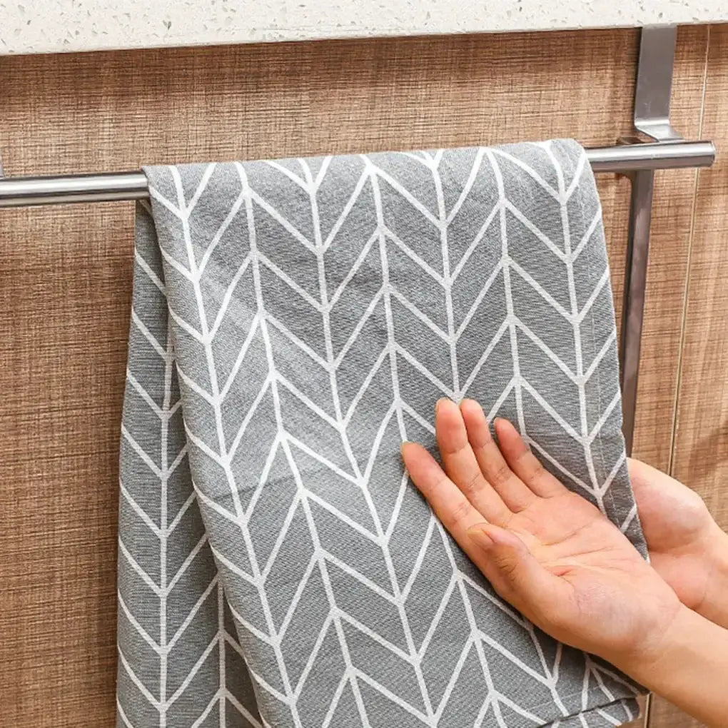 Stainless Steel Towel Bar - Durable & Rust-Resistant, holding a patterned towel on a cabinet door, ideal for bathroom or kitchen use.