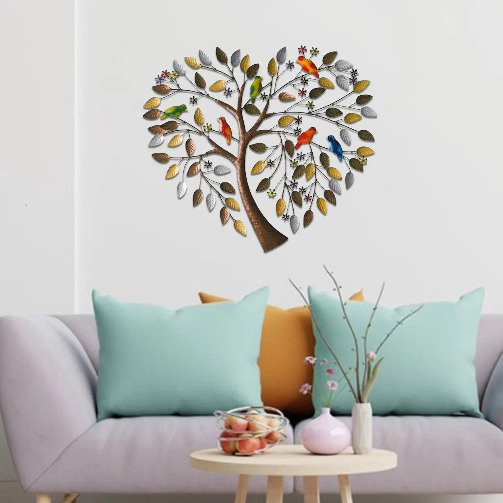 Heart Shape Family Tree Wall Decor - Metal Art Piece above a pastel sofa, adding charm with its colorful birds and heart-shaped tree design.