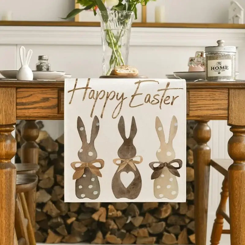 Linen Easter Bunny Table Runner with 'Happy Easter' text and bunny silhouettes. Ideal for holiday table decor and spring gatherings.