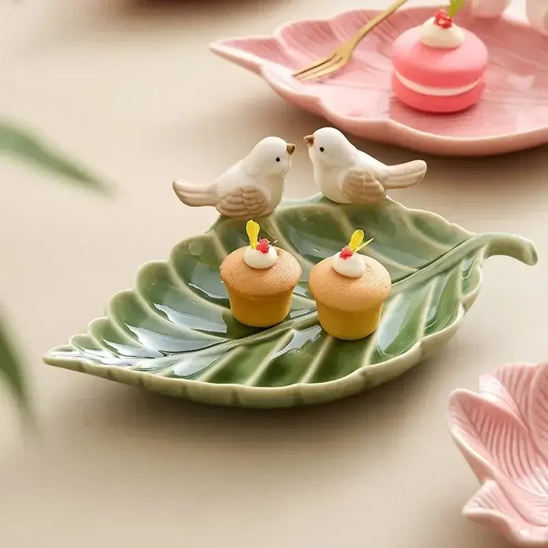 Green leaf-shaped ceramic jewelry tray with two bird figurines, part of the Ceramic Jewelry Storage Trays - Elegant and Practical Jewelry Organizers collection.