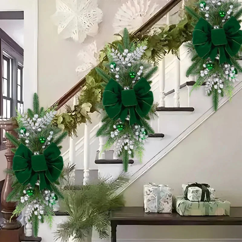 Green Christmas Stair Wreaths with silver accents and lights on staircase. Festive garland decor for home holiday celebrations.