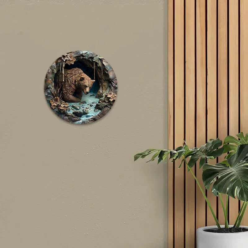 Brown Bear Cave Aluminum Sign mounted on a beige wall near wood paneling and a plant. Durable rustic decor for home or garden.