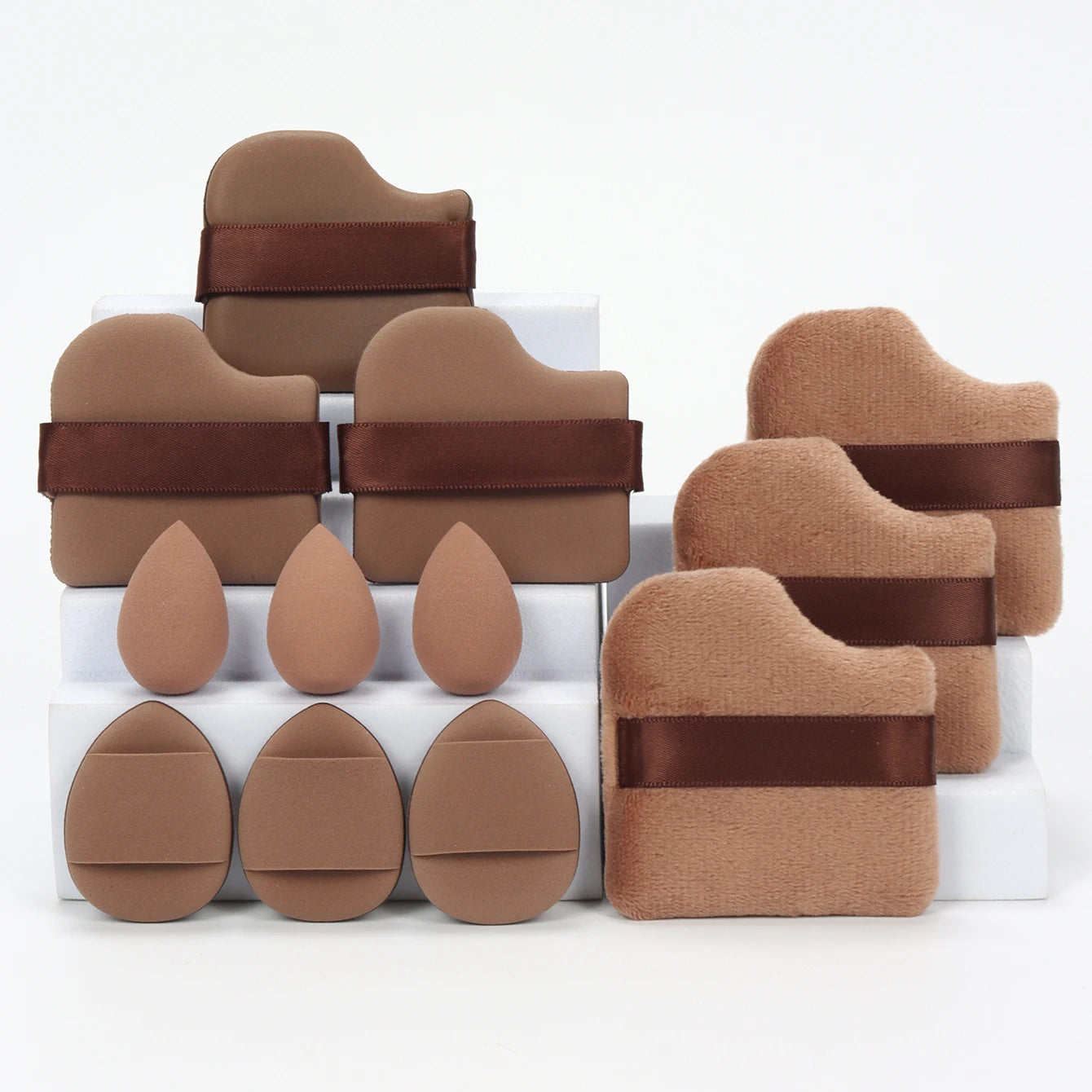 Brown-toned 12-piece makeup sponge set with ergonomic puffs and sponges. Great for precise application and minimal product absorption.