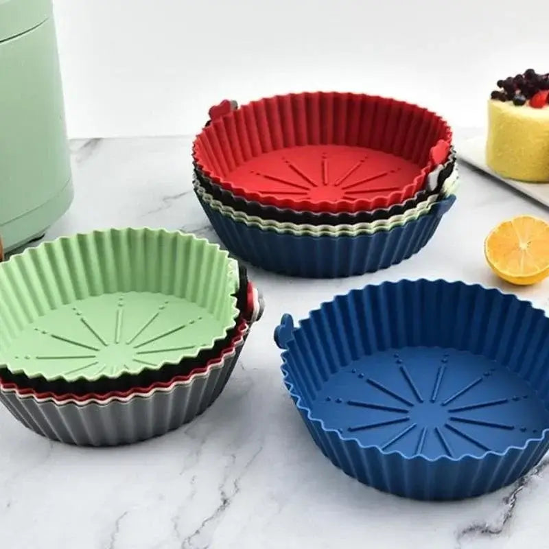 Colorful set of silicone air fryer liners pot with ribbed design for improved air circulation. Reusable and fits most air fryer baskets.