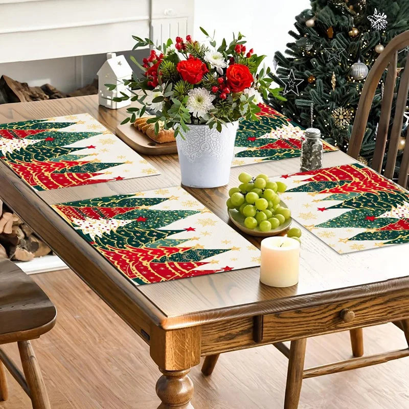 Green and red Christmas tree Linen Placemats on a wooden dining table with floral centerpiece. Durable linen fabric enhances holiday decor.