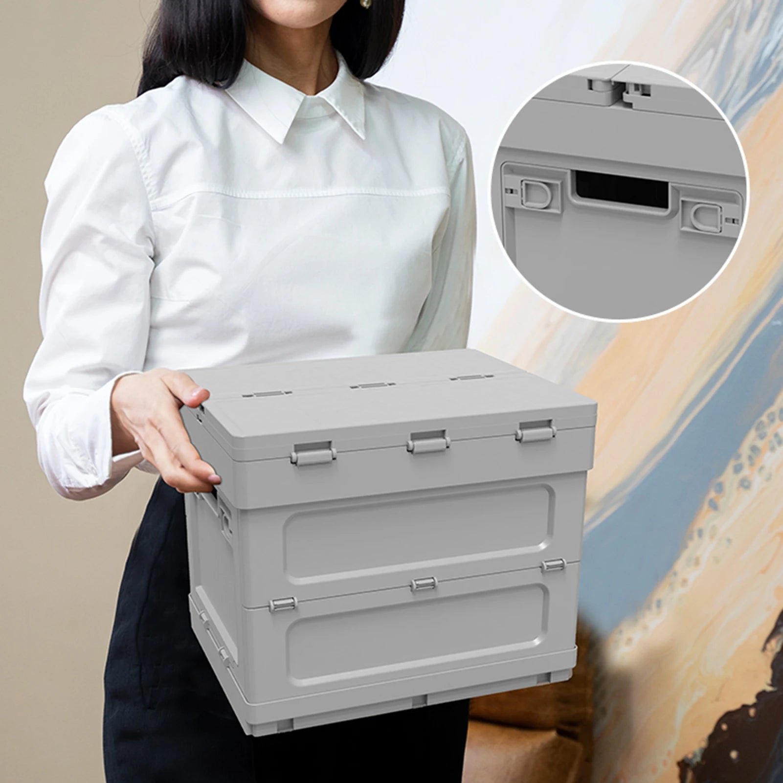 Compact portable picnic table with storage held by a woman. Lightweight and foldable design for easy transport and use.