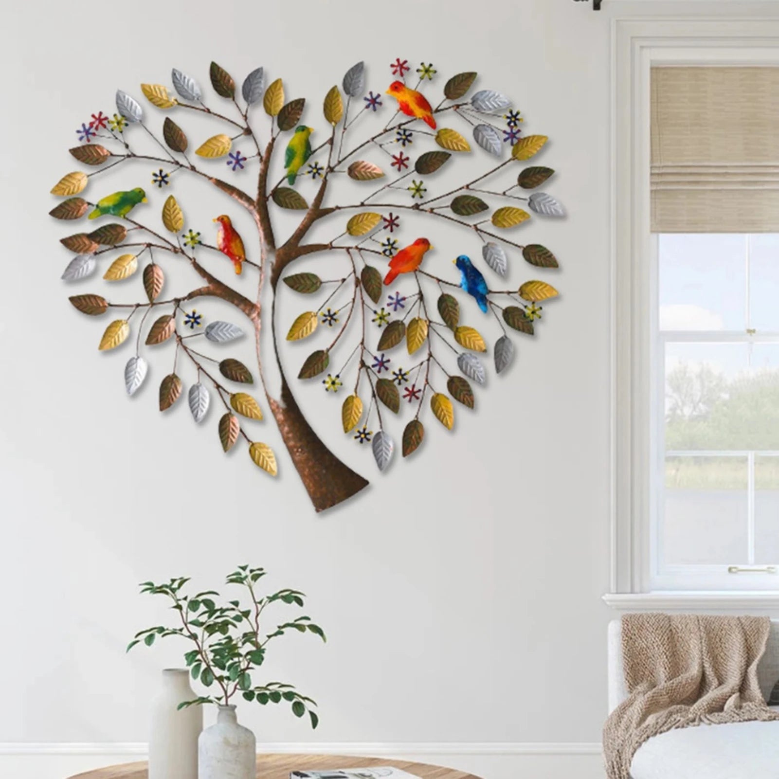 Heart Shape Family Tree Wall Decor - Metal Art Piece displayed in a modern living room, showcasing vibrant birds and metallic leaves.