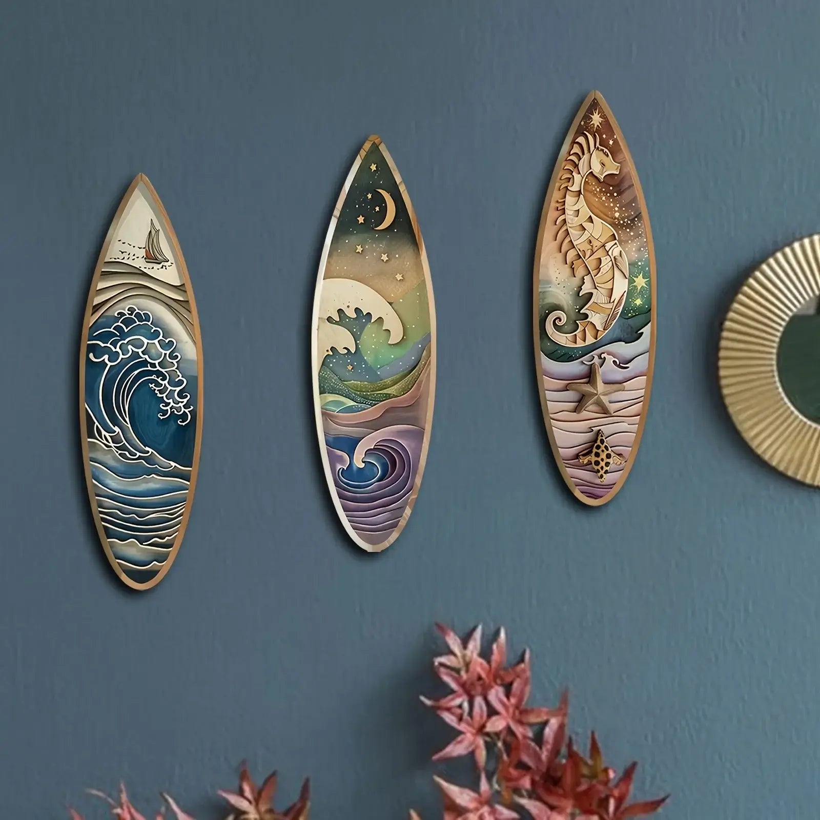 3PCS Wooden Surfboard Wall Decor with ocean wave, moonlit sea, and seahorse art on a blue wall. Perfect nautical artwork for beach-inspired rooms.