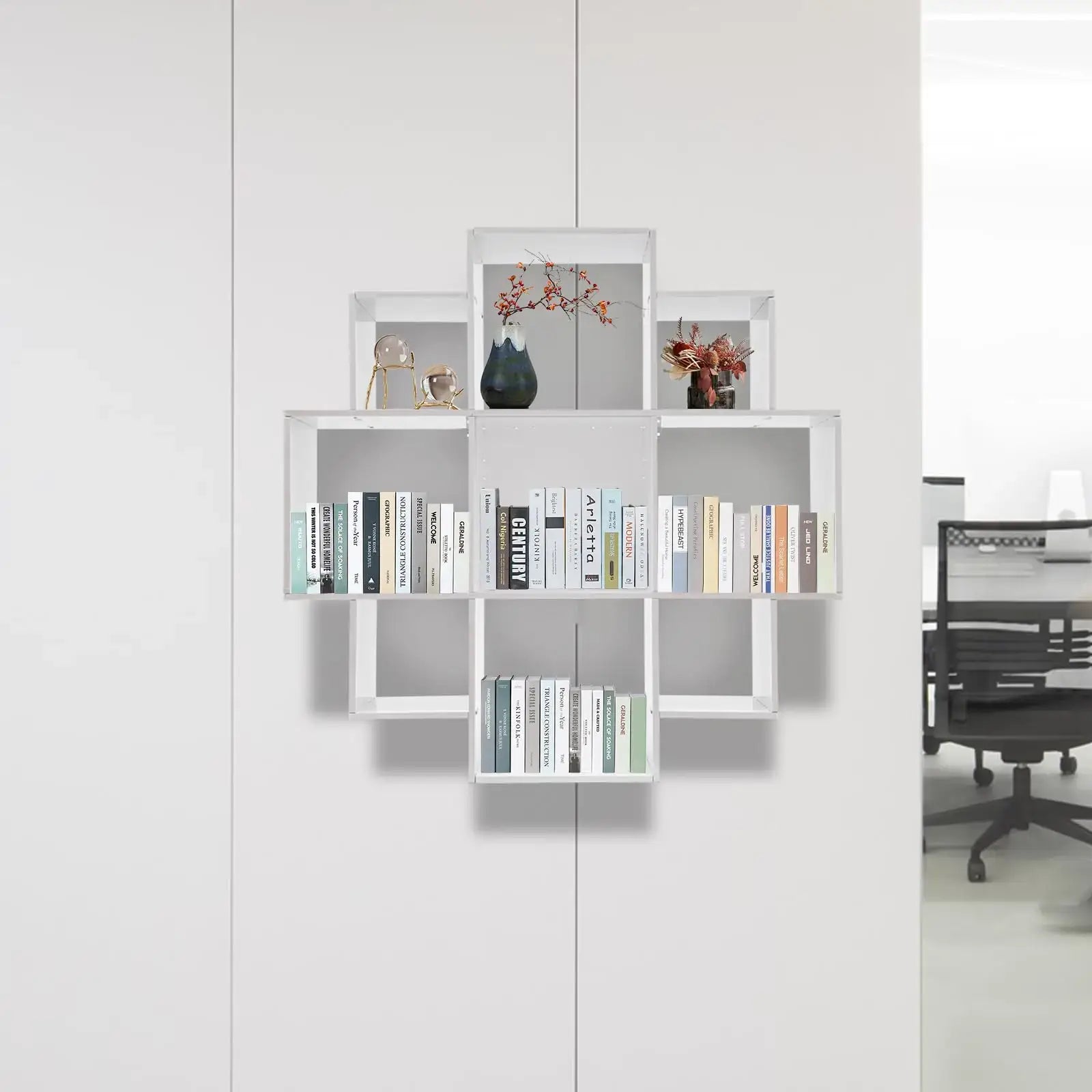 Wall Mounted Bookshelf - Modern 3-Tier Floating shelf with geometric design, holding books and decor in a minimalist office space.