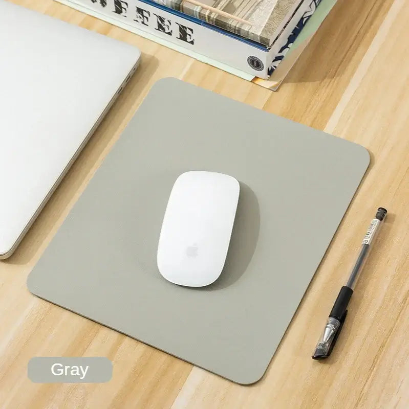 Gray Small PU Leather Gaming Mouse Pad with anti-slip base, ideal for precise mouse control on any desktop.