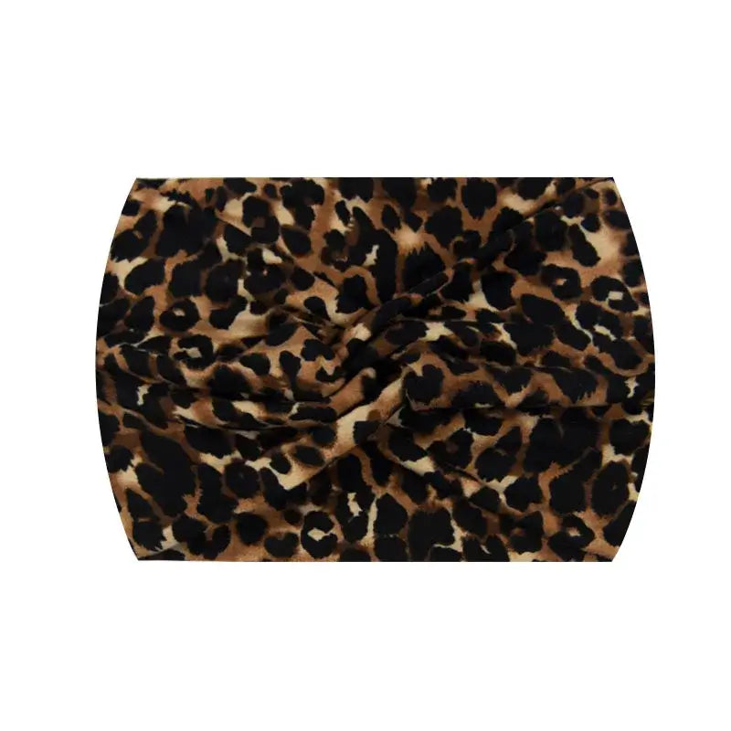Dark brown leopard print 18CM stretch printed headband. Comfortable and stylish for sports or casual outfits.