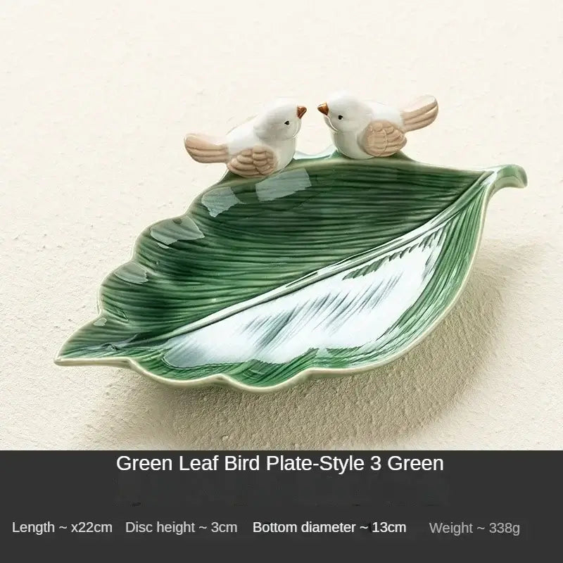 Green ceramic leaf jewelry tray with bird figurines, labeled Style 3 Green, ideal for elegant accessory storage.