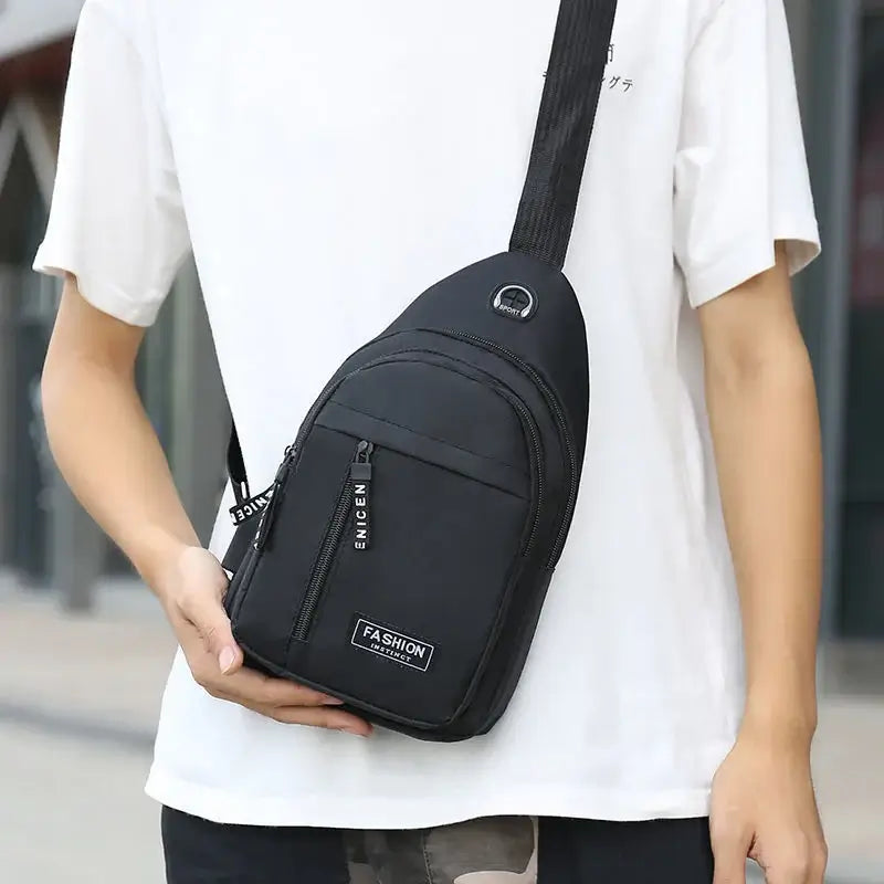 Model displaying black multifunctional crossbody shoulder bag worn diagonally, ideal for casual and urban fashion styles.