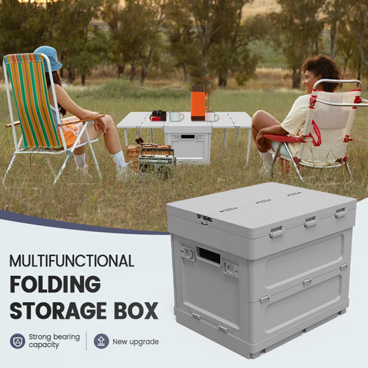 Portable picnic table with storage and cooler feature used outdoors by two people. Folding design ideal for camping and picnics.