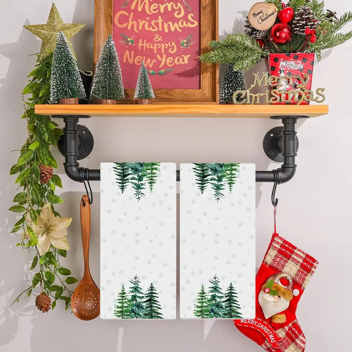 White Christmas kitchen towels with green pine tree print. Cotton towels ideal for winter-themed kitchen decoration and drying.