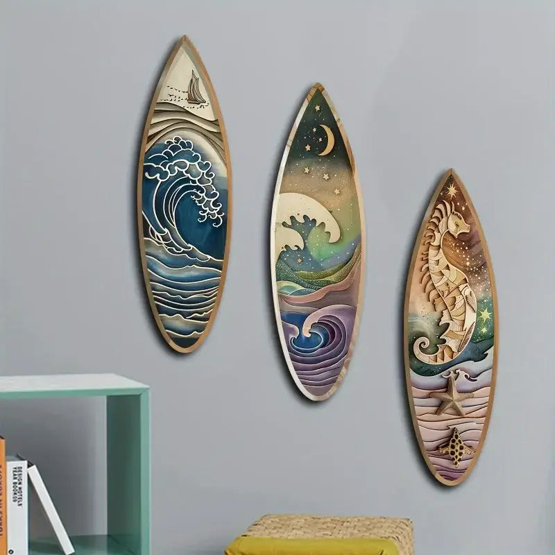 Wooden Surfboard Wall Decor - 3PCS Nautical Art set on a gray wall above a shelf. Enhances beach-themed home decor with vibrant ocean imagery.