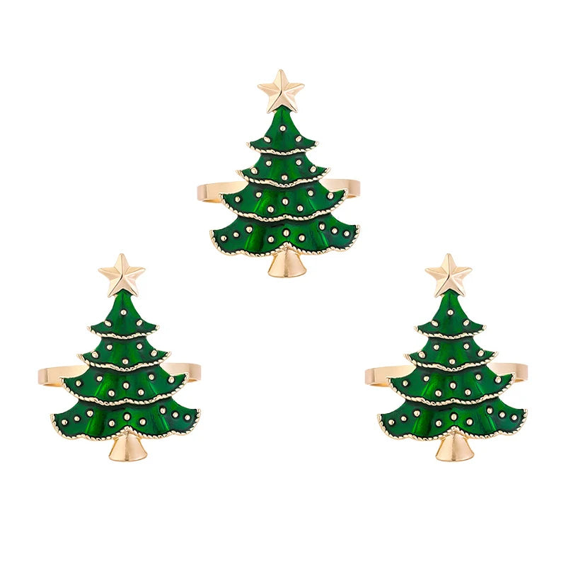 Three Christmas tree napkin rings with gold bands and green tree design, great for holiday tableware and seasonal decor.