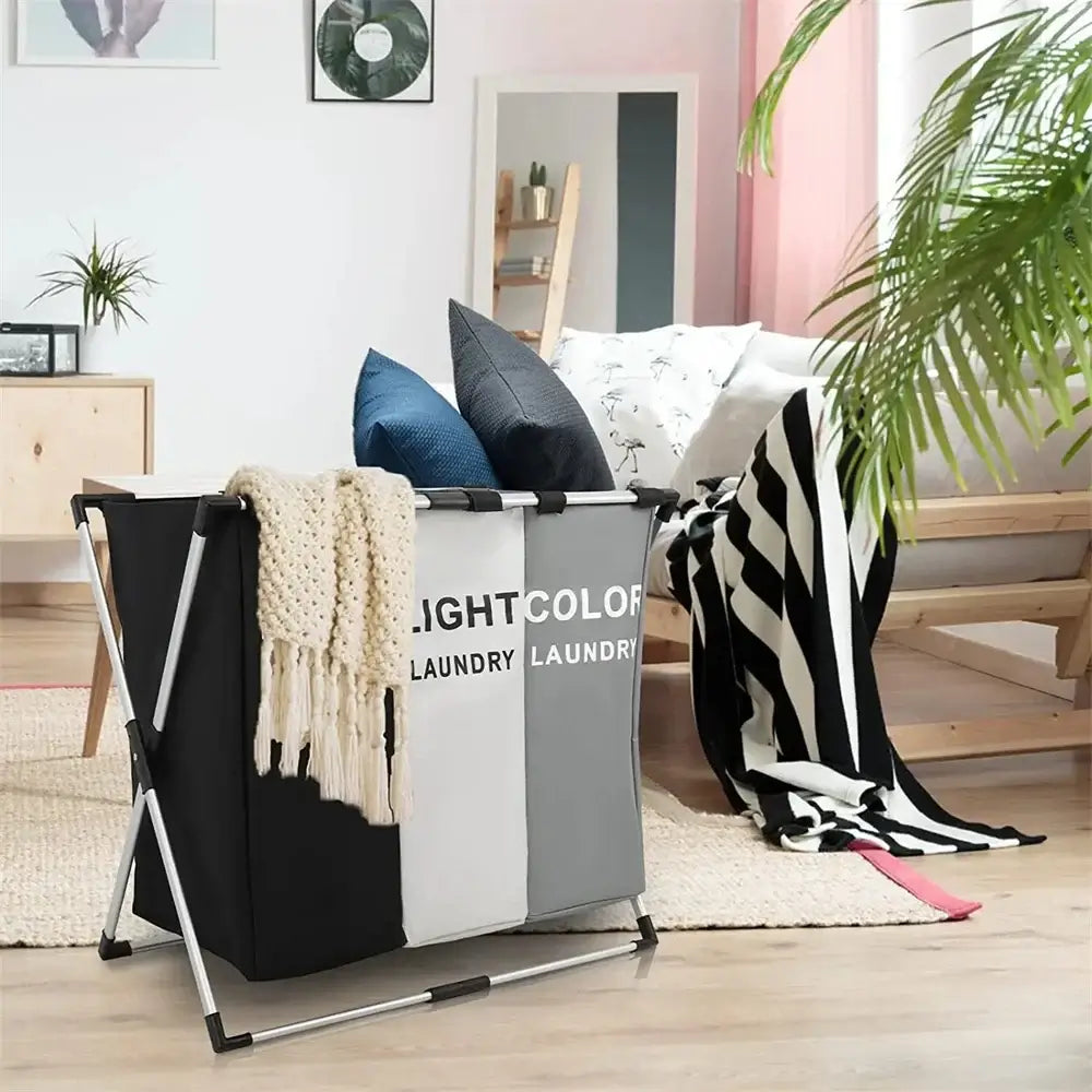 Stylish 3 Grids Laundry Basket - Foldable Organizer placed in modern living room. Great for organizing laundry in small home spaces.