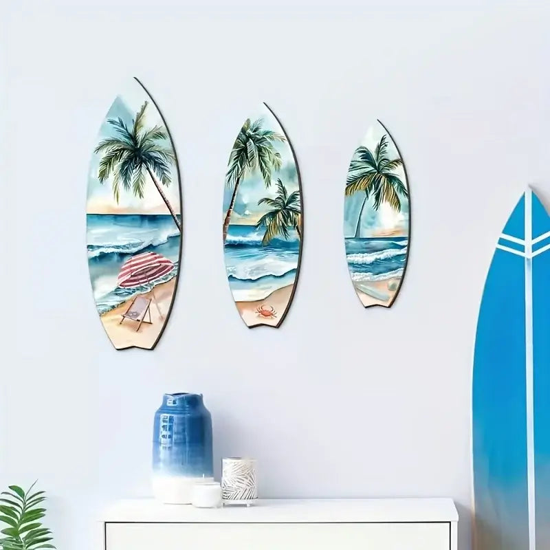 Wooden Surfboard Wall Decor Set of 3 featuring tropical beach scenes, mounted above a white cabinet with blue ceramic vase.
