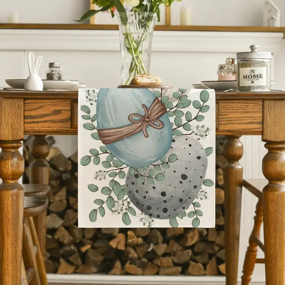 Linen Easter table runner with eucalyptus and egg design draped over a rustic dining table. Adds festive charm to holiday gatherings.