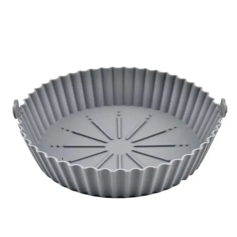 Grey air fryer silicone liners pot with fluted edges and raised base for better air circulation. Durable and food-safe material.