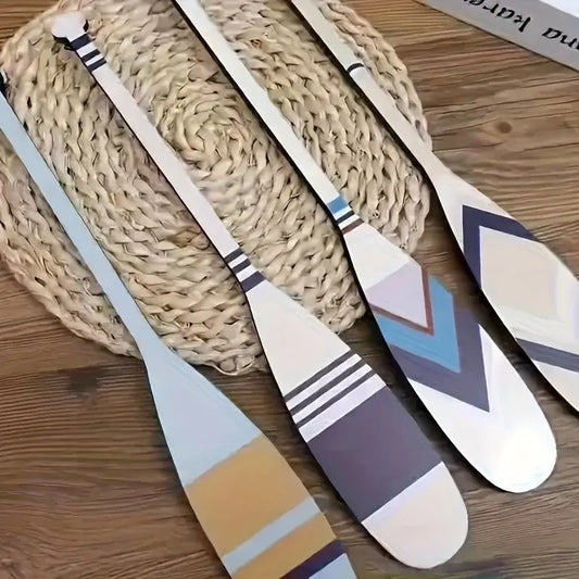 Set of four 15.7" handcrafted nautical paddles decor with coastal colors and patterns, ideal for indoor or outdoor beach-themed spaces.