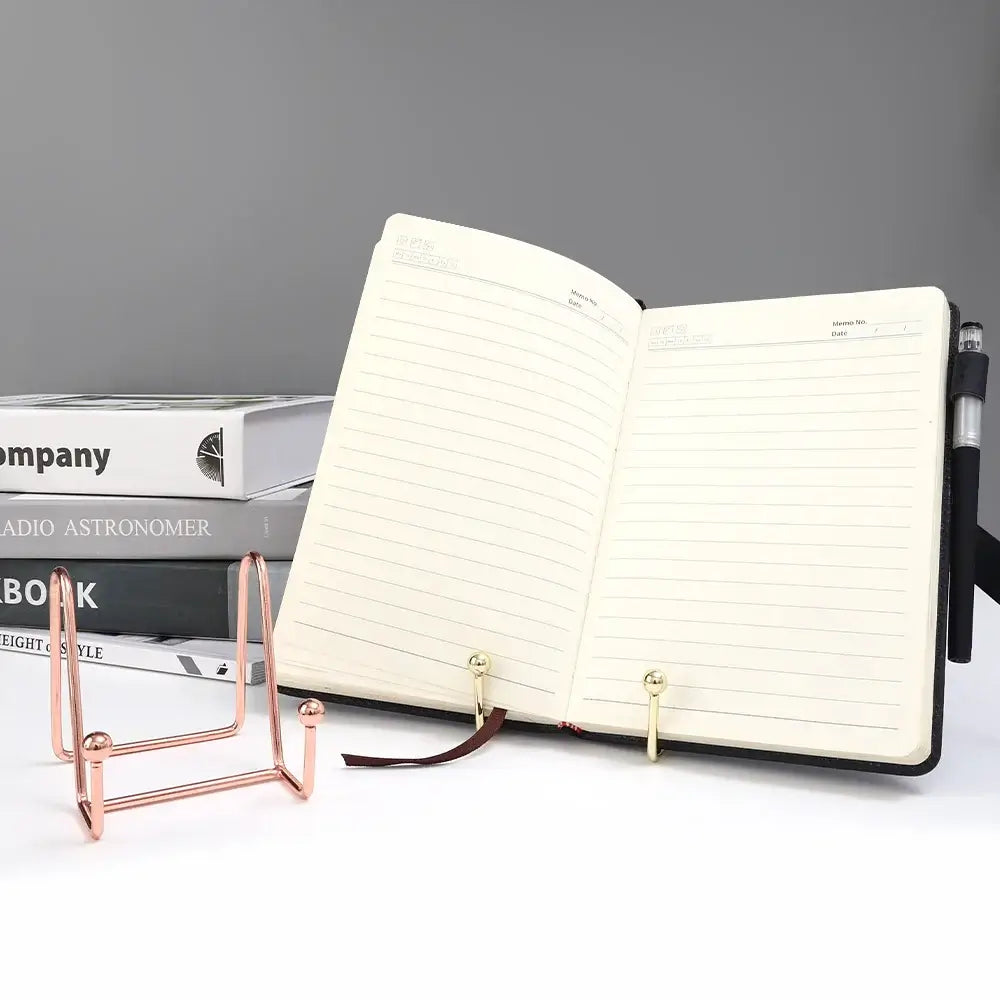 Notebook displayed on gold and rose gold art display frame stands. Great for organizing and showcasing open books or frames.