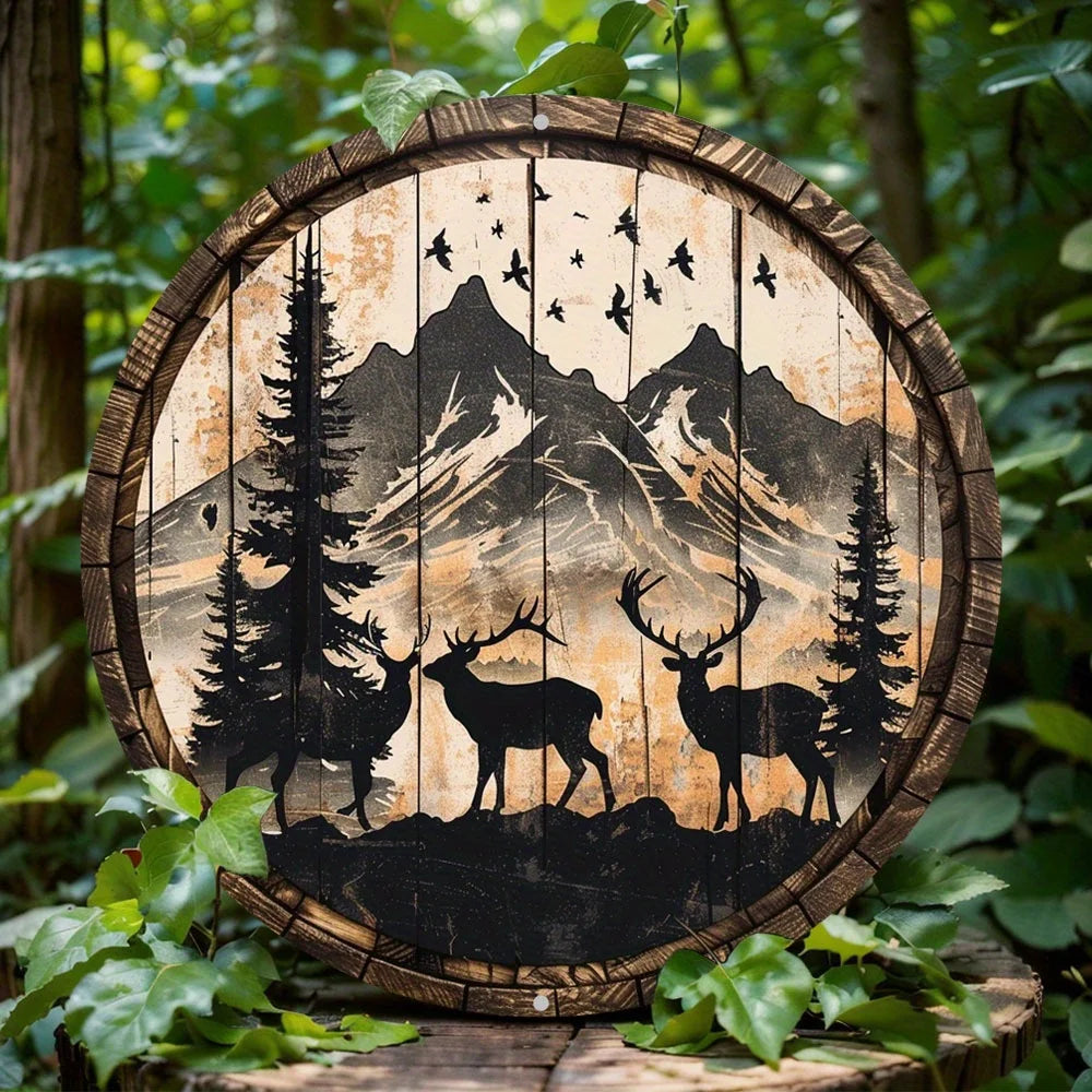 Round metal deer sign with elk and buck silhouettes, pine trees, and mountain backdrop. Ideal wildlife metal art for indoor or outdoor decor.