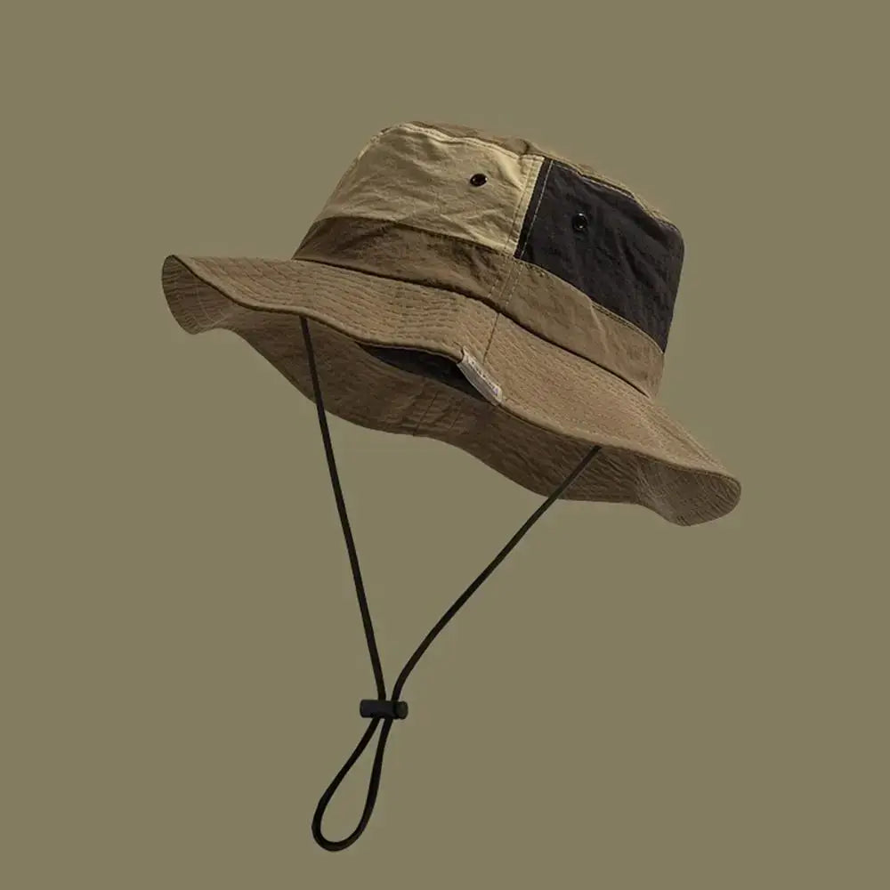 Khaki Sun Protection Bucket Hat - Quick-dry with black and beige panels. Features adjustable chin strap and UV-blocking fabric.