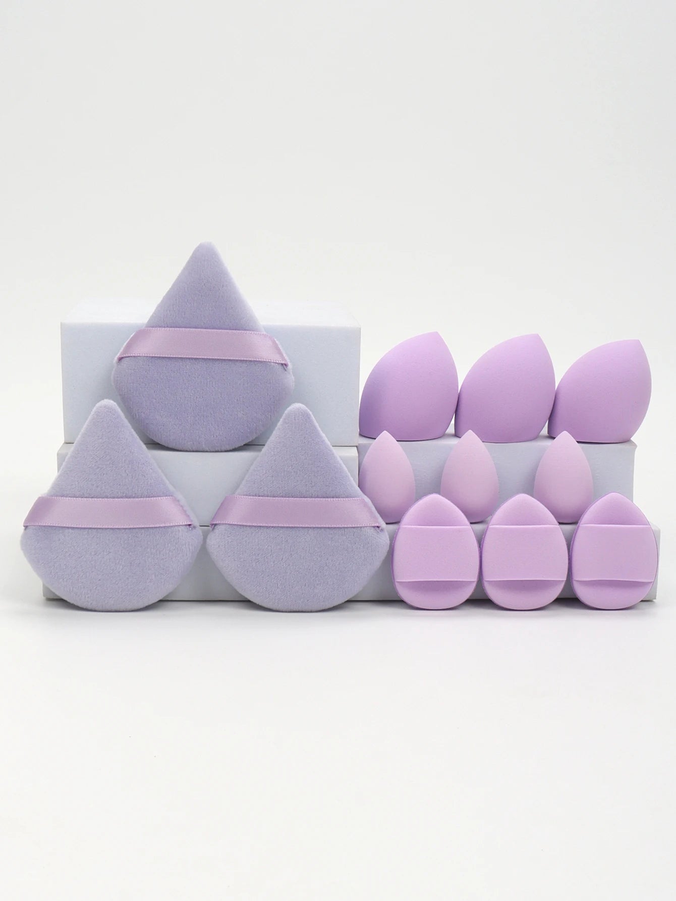 Lavender 12-piece makeup sponge set featuring various sponge shapes and powder puffs for flawless makeup application and blending.